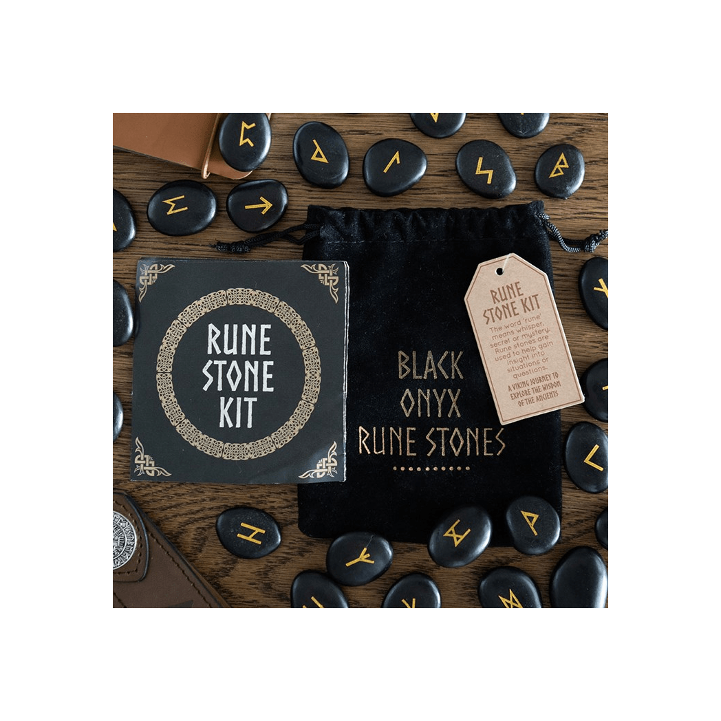 Set of 25 Black Onyx Rune Stones and Rune Stone Kit displayed on a wooden table, highlighting Norse mythology elements.