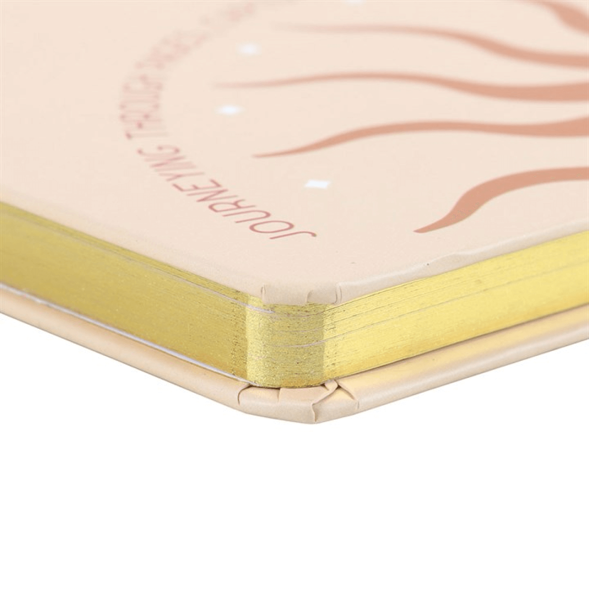 Close-up of a pink and gold product with 'Surratt' branding on a white background