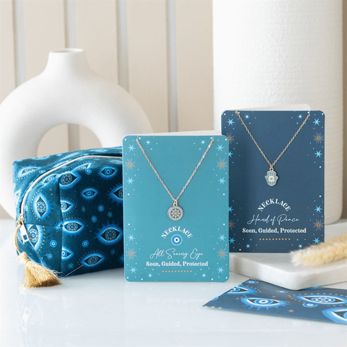 Necklace on a card with decorative packaging on a white surface