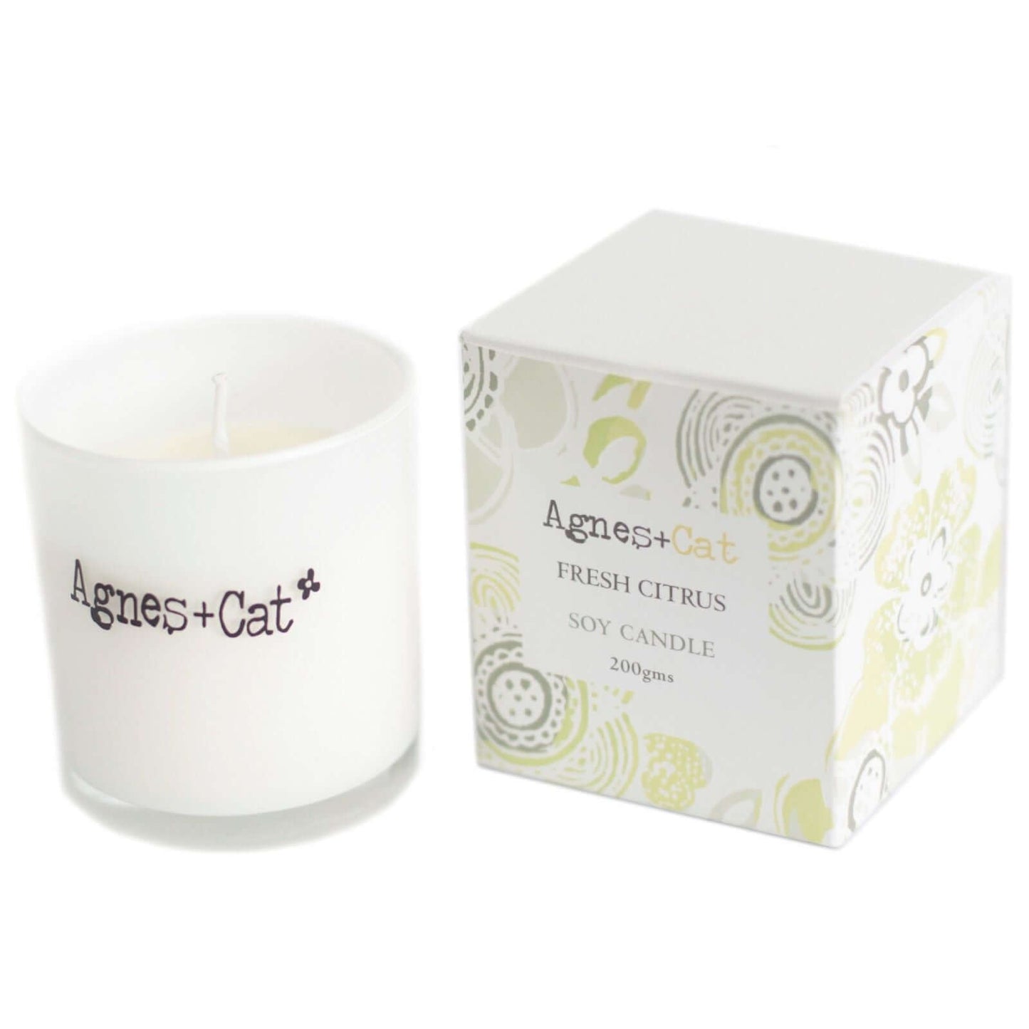 Agnes + Cat Votive Candle in Fresh Citrus scent with white container and floral patterned packaging, natural soy wax.