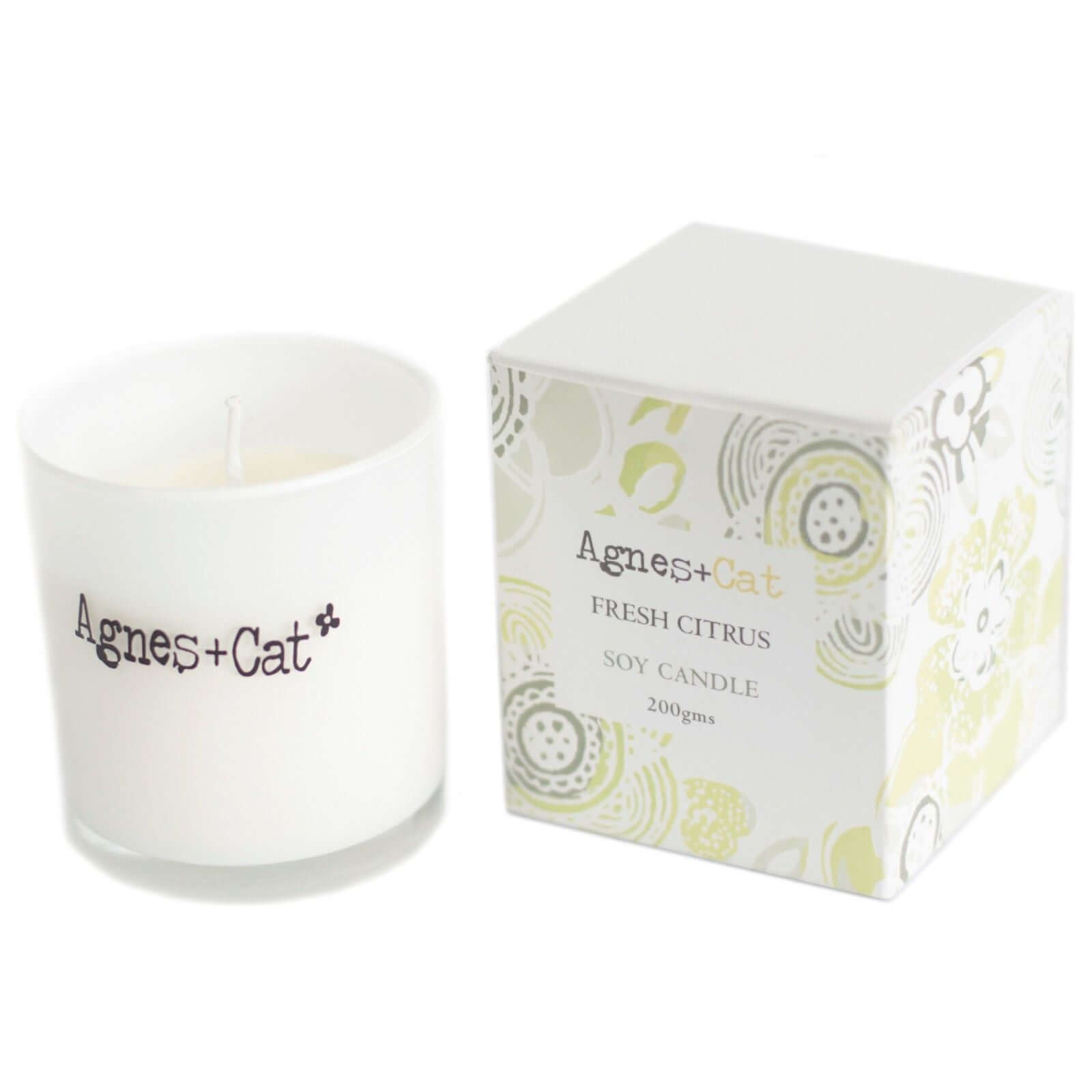 Agnes + Cat Votive Candle in Fresh Citrus scent with white container and floral patterned packaging, natural soy wax.