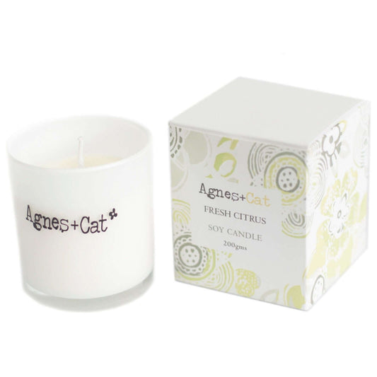 Agnes + Cat Votive Candle in Fresh Citrus scent with white container and floral patterned packaging, natural soy wax.