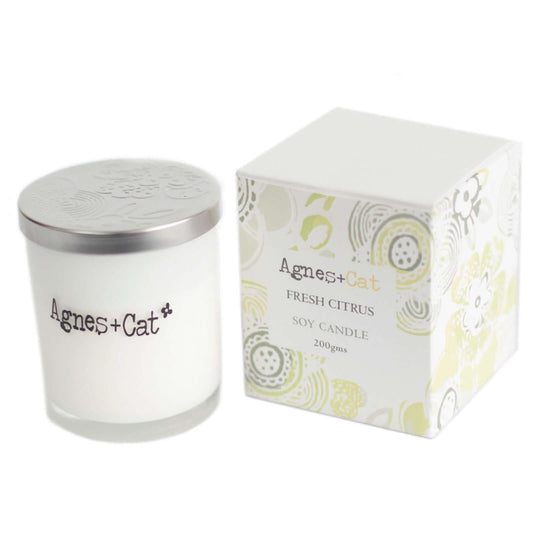 Agnes + Cat votive candle in fresh citrus scent with a decorative box, made from natural soy wax.