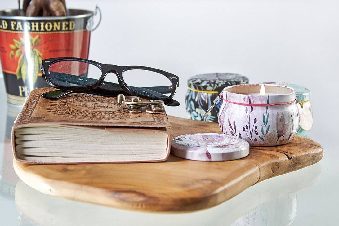 Art Tin Candle - Assorted Design - Russian Dolls - Dolly Blue with glasses and notebook on wooden board.