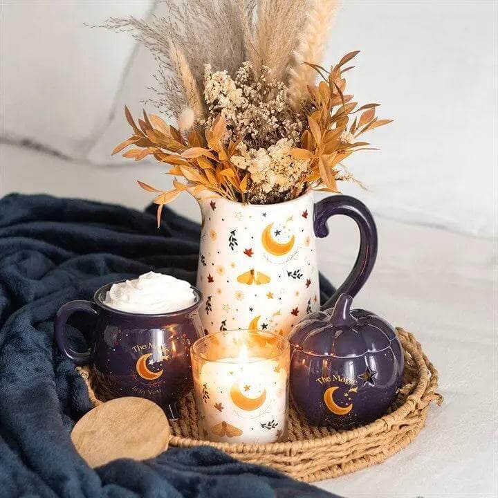 Autumn Magic Harvest Moon Print Ceramic Flower Jug with decorative elements and autumn foliage in a cozy setting.