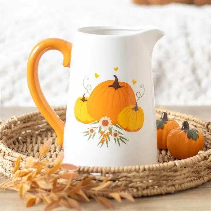 Autumn Pumpkin Ceramic Flower Jug decorated with pumpkins and flowers on a woven tray in fall home décor setting.