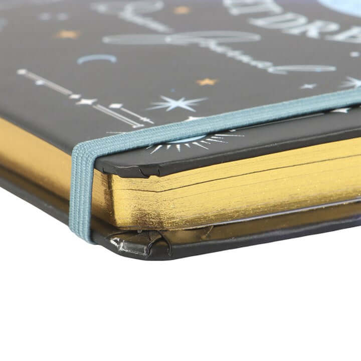Notebook with gold binding and starry night design on cover