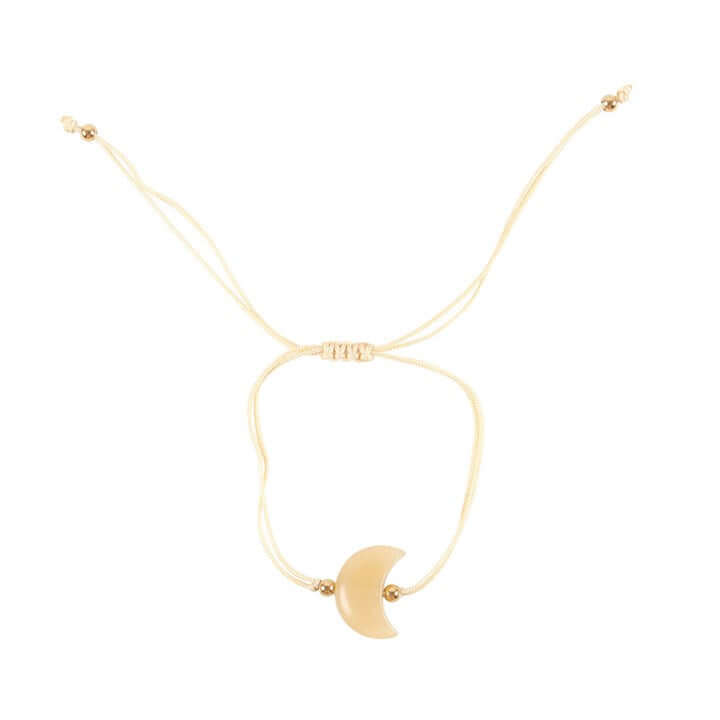 Be Brave Yellow Jade Crystal Moon Bracelet featuring a crescent moon charm on a cord.