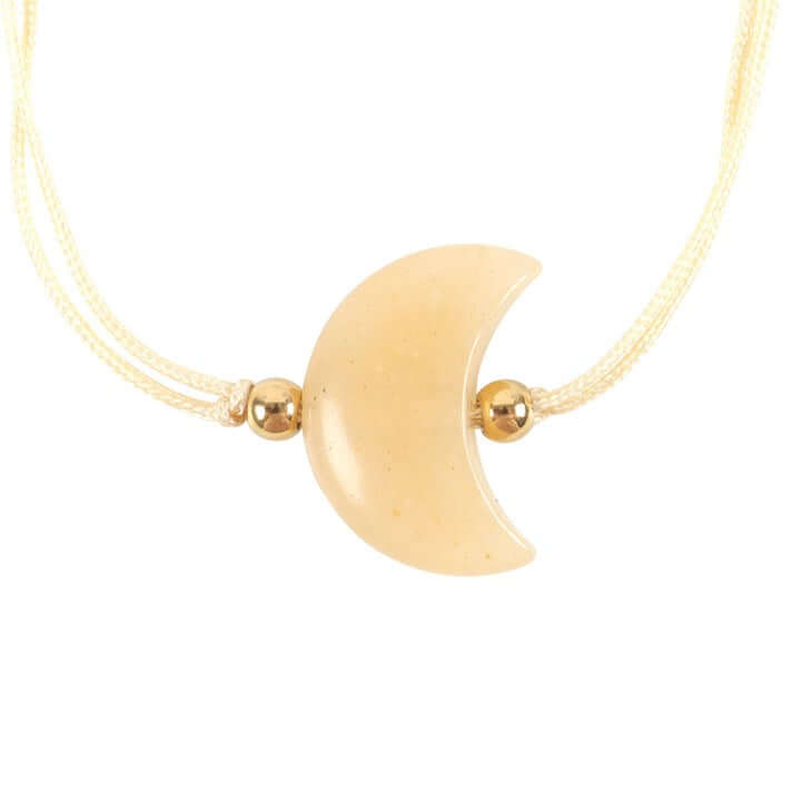 Be Brave Yellow Jade Crystal Moon Bracelet featuring a crescent moon charm and gold accents on a delicate cord.