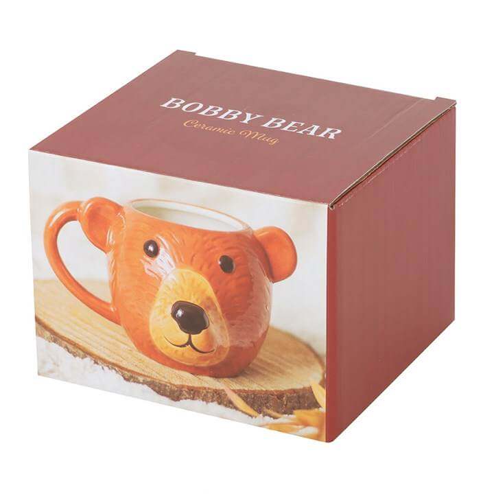Bear Shaped Mug in a red box with wooden coaster, showcasing its adorable ceramic design.