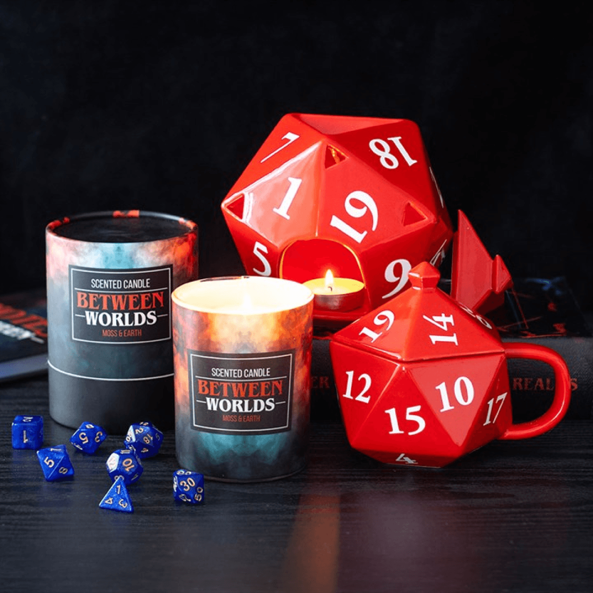 Between Worlds Moss & Earth candles displayed with gaming dice, creating an enchanting atmosphere for relaxation and play.