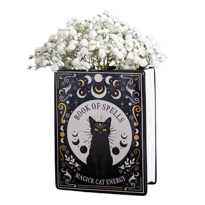 Black Cat Magick Book Shaped Flower Vase with white flowers, designed like a spell book, adding charm to any space.