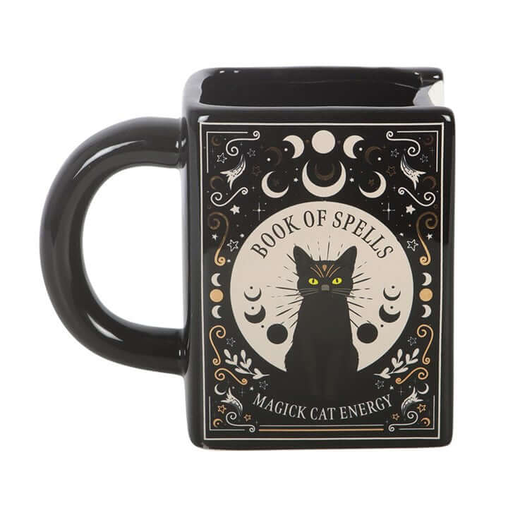 Black Cat Magick Book of Spells Book Shaped Mug showcasing a mystical design and a striking black cat motif.