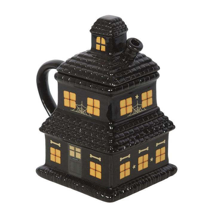 Black Haunted House Mug, spooky ceramic cup with detailed haunted house design for Halloween lovers.
