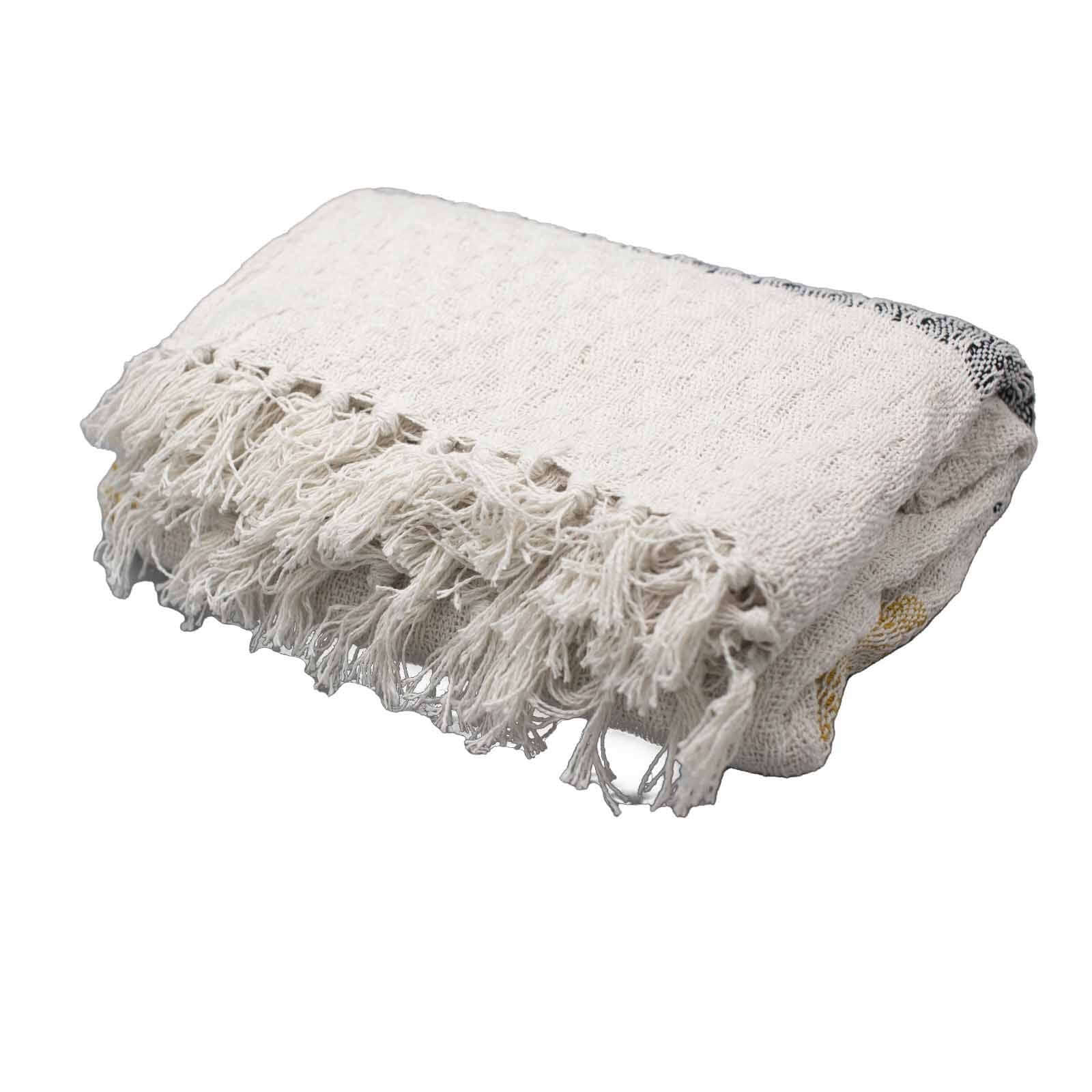 Boho Comfort Throws - Mellow Mattala lightweight cream cotton throw with tasselled edges and golden accents.
