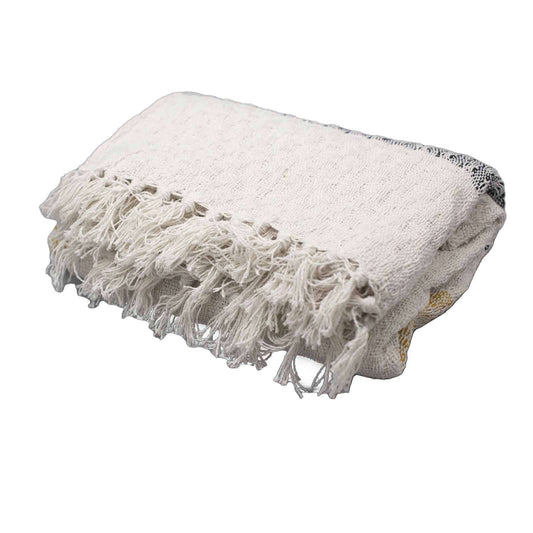 Boho Comfort Throws - Mellow Mattala lightweight cream cotton throw with tasselled edges and golden accents.