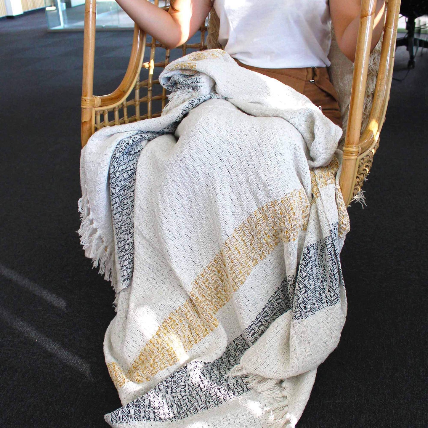 Boho Comfort Throws - Mellow Mattala, soft cream cotton throw with golden accents and grey stripes, perfect for home decor.