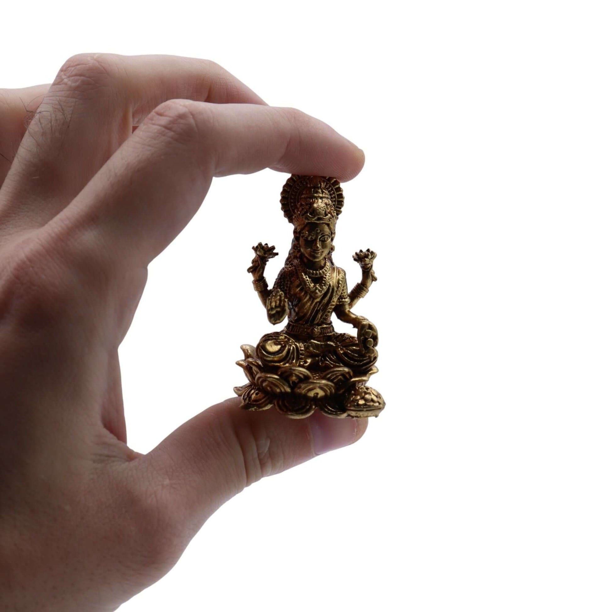 Brass Miniature Gods - Laxmi statue held in hand, showcasing intricate details and polished antique finish.