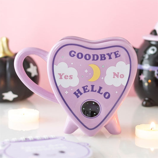 Pastel planchette shaped ceramic mug with celestial design for tea and coffee.