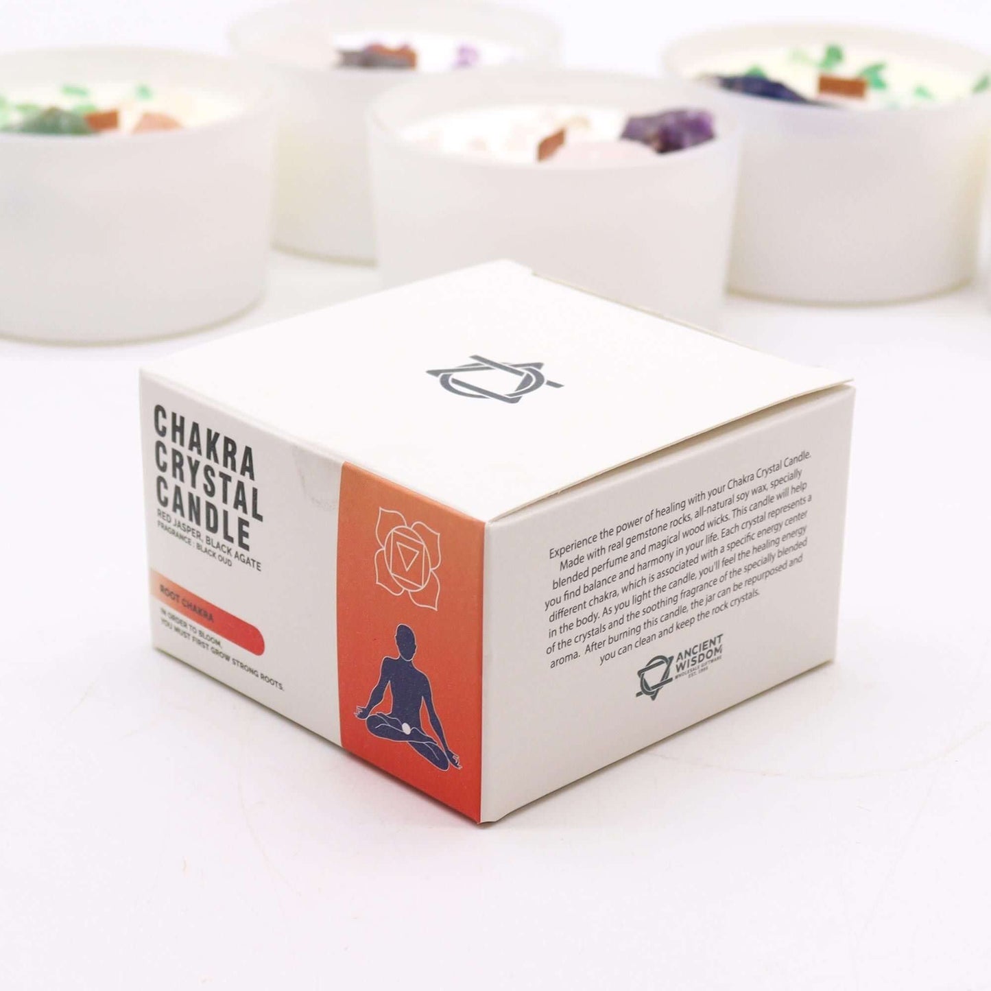 Chakra Crystal Candle - Root Chakra packaging with meditative design and earthy colors.