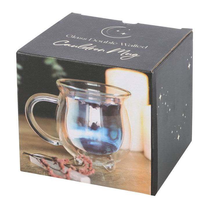 Clear double walled glass cauldron mug displayed in a box, perfect for magical sipping. Cauldron Mug.