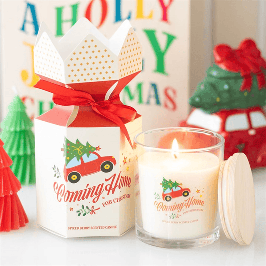 Coming Home for Christmas Spiced Berry Candles in decorative holder with festive packaging and holiday decor.