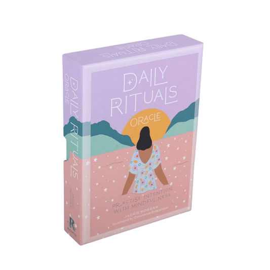 Daily Rituals Oracle Cards box featuring a woman in a colorful dress promoting mindfulness and intention.