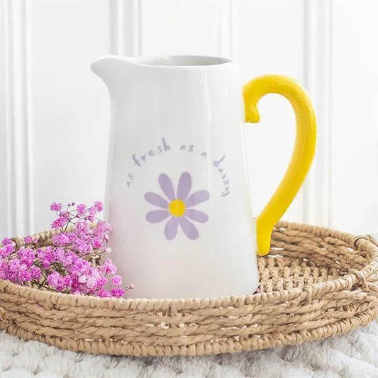 Fresh as a Daisy Ceramic Flower Jug with yellow handle and floral design, perfect for spring décor.