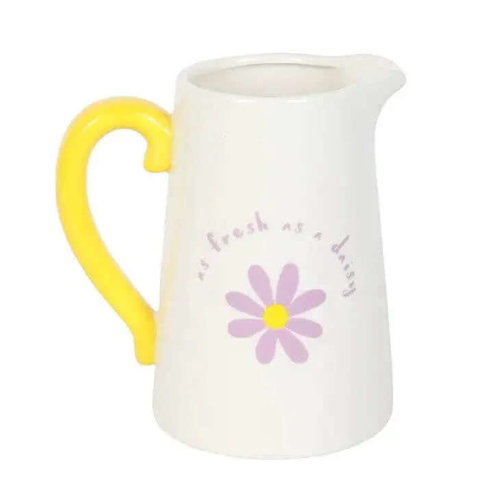 Fresh as a Daisy ceramic flower jug with yellow handle and purple floral design, ideal for spring décor and gifts.