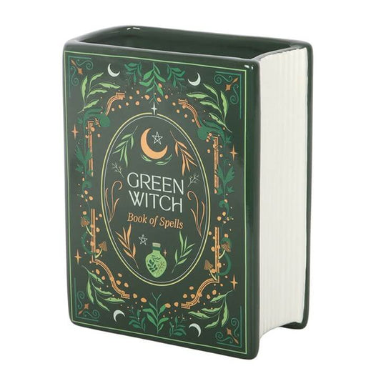 Green Witch Book of Spells with decorative cover on a white background