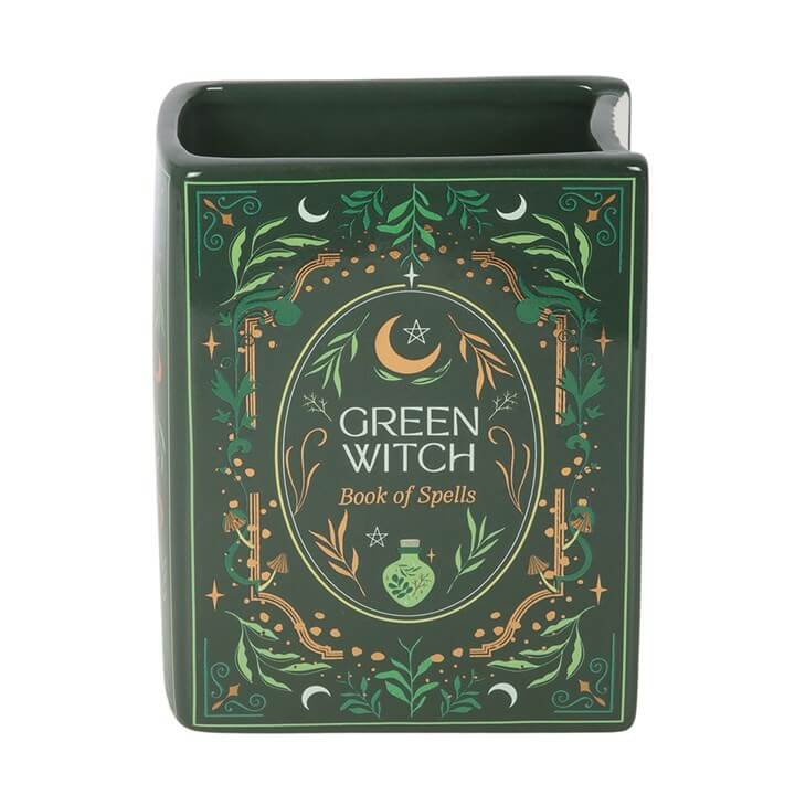 Decorative book titled 'Green Witch Book of Spells' with green and gold design on a white background