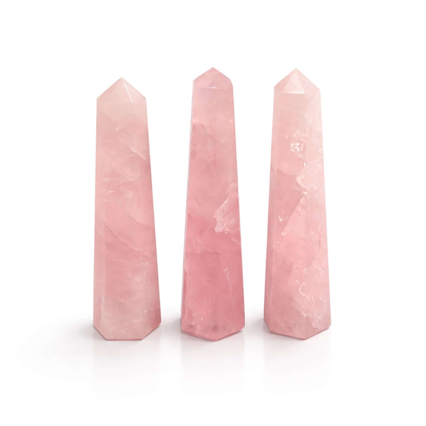 Gemstone Six Face Obelisk - three polished Rose Quartz points in soft pink tones, ideal for decoration and meditation.
