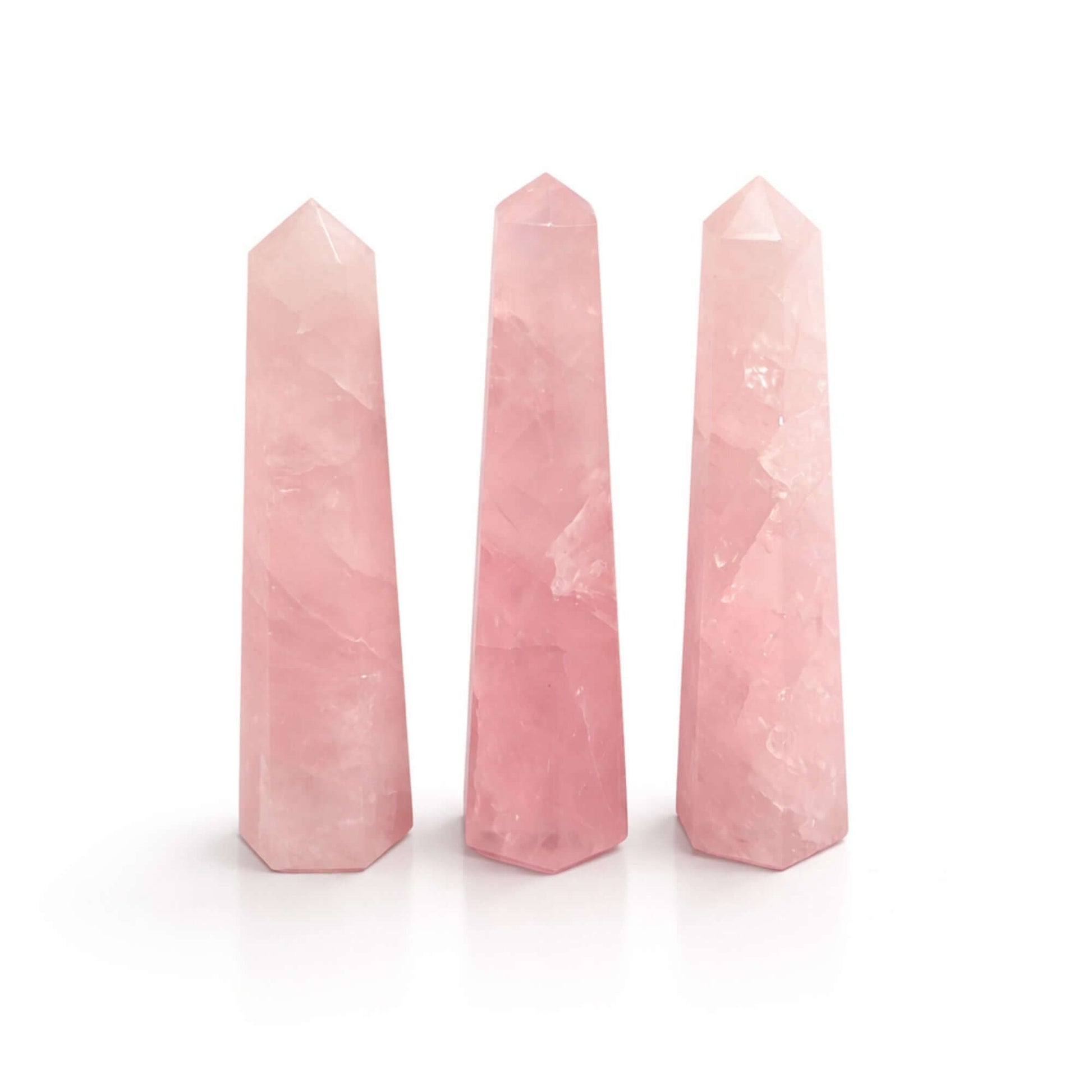 Gemstone Six Face Obelisk - three polished Rose Quartz points in soft pink tones, ideal for decoration and meditation.
