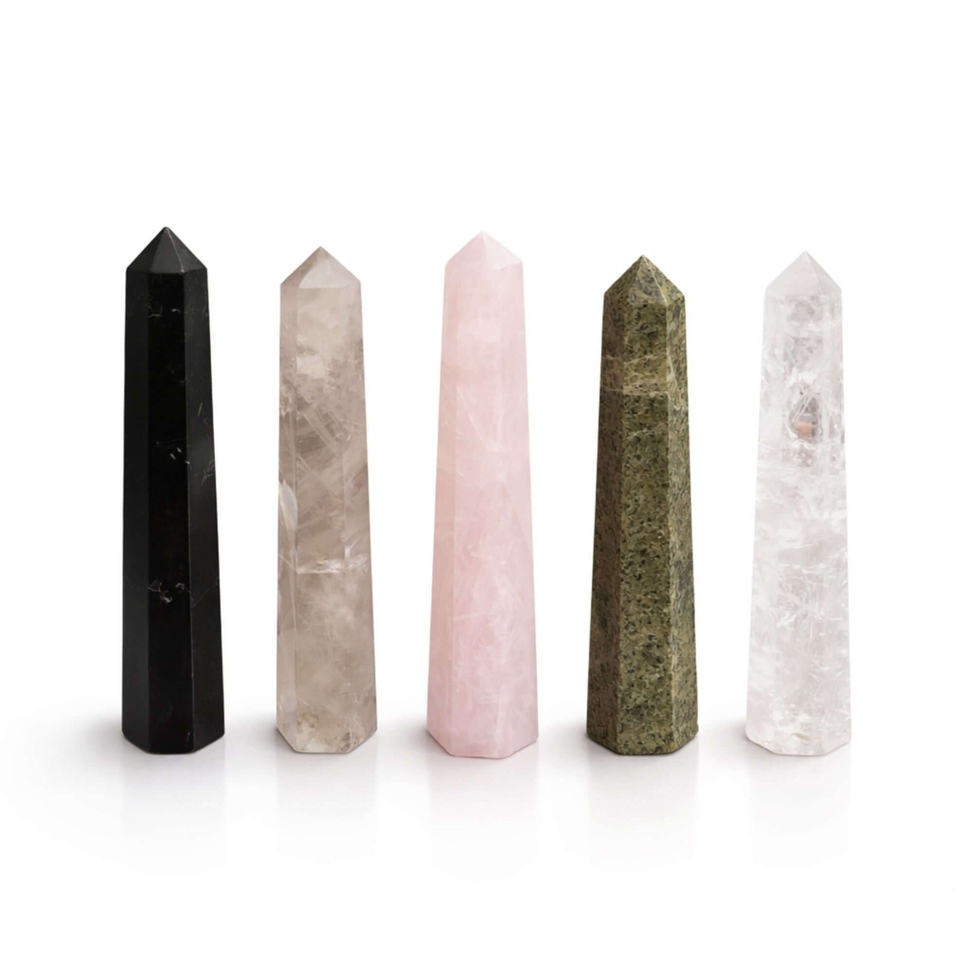 Gemstone Six Face Obelisk, featuring black, smoky, rose quartz, green, and clear crystal obelisks arranged together.