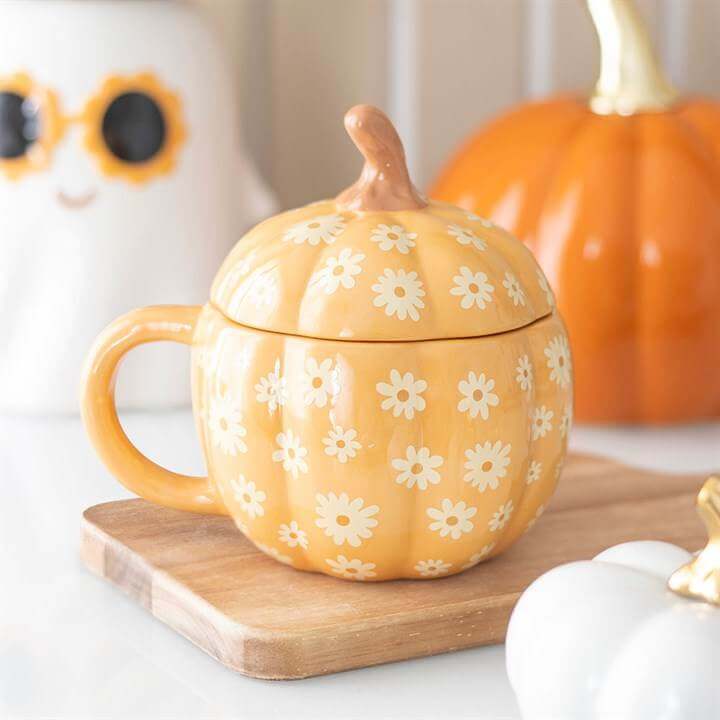 Pumpkin Lidded Mug featuring a groovy floral pattern, perfect for autumn and Halloween drinkware.