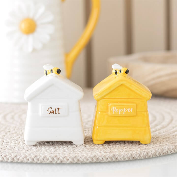 Beehive Salt and Pepper Shakers featuring a white salt shaker and a yellow pepper shaker design.