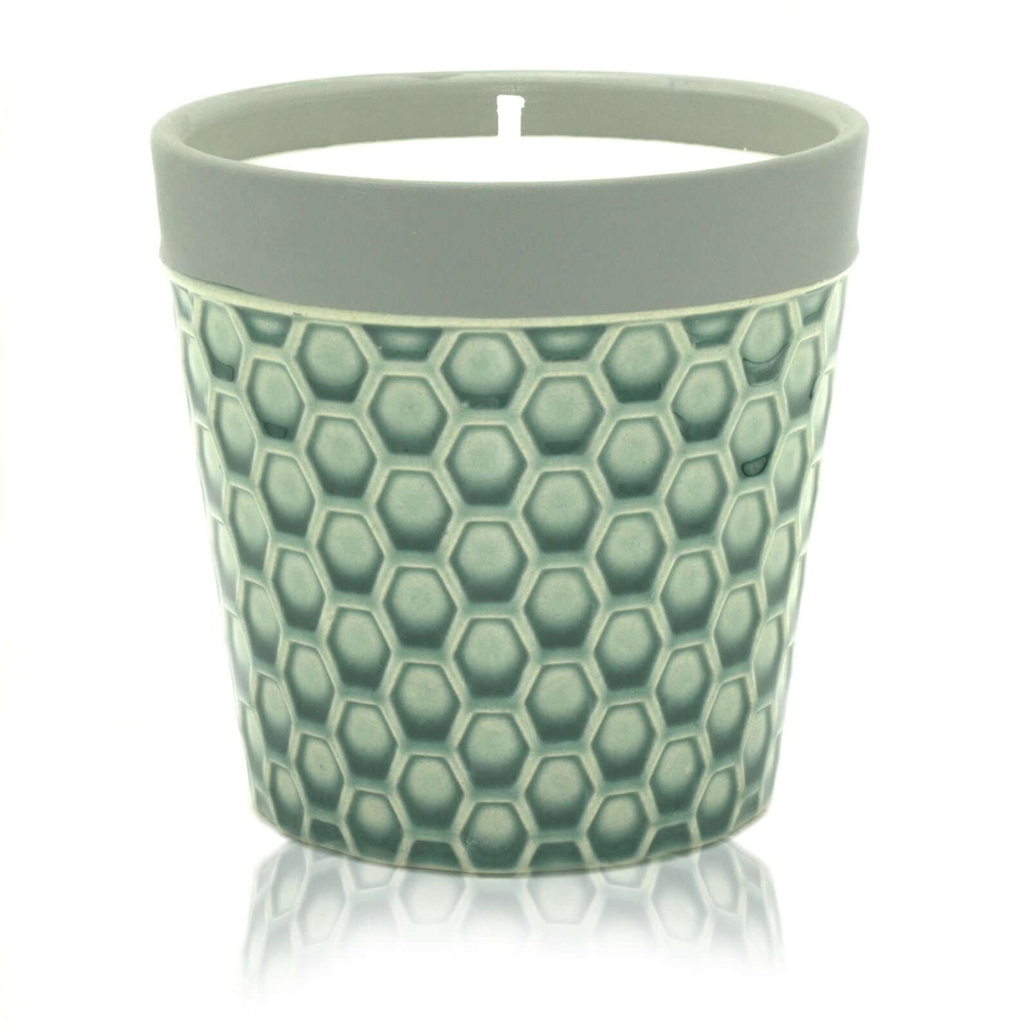Home Candle displayed in a stylish hexagon patterned candle pot, perfect for enhancing home decor.
