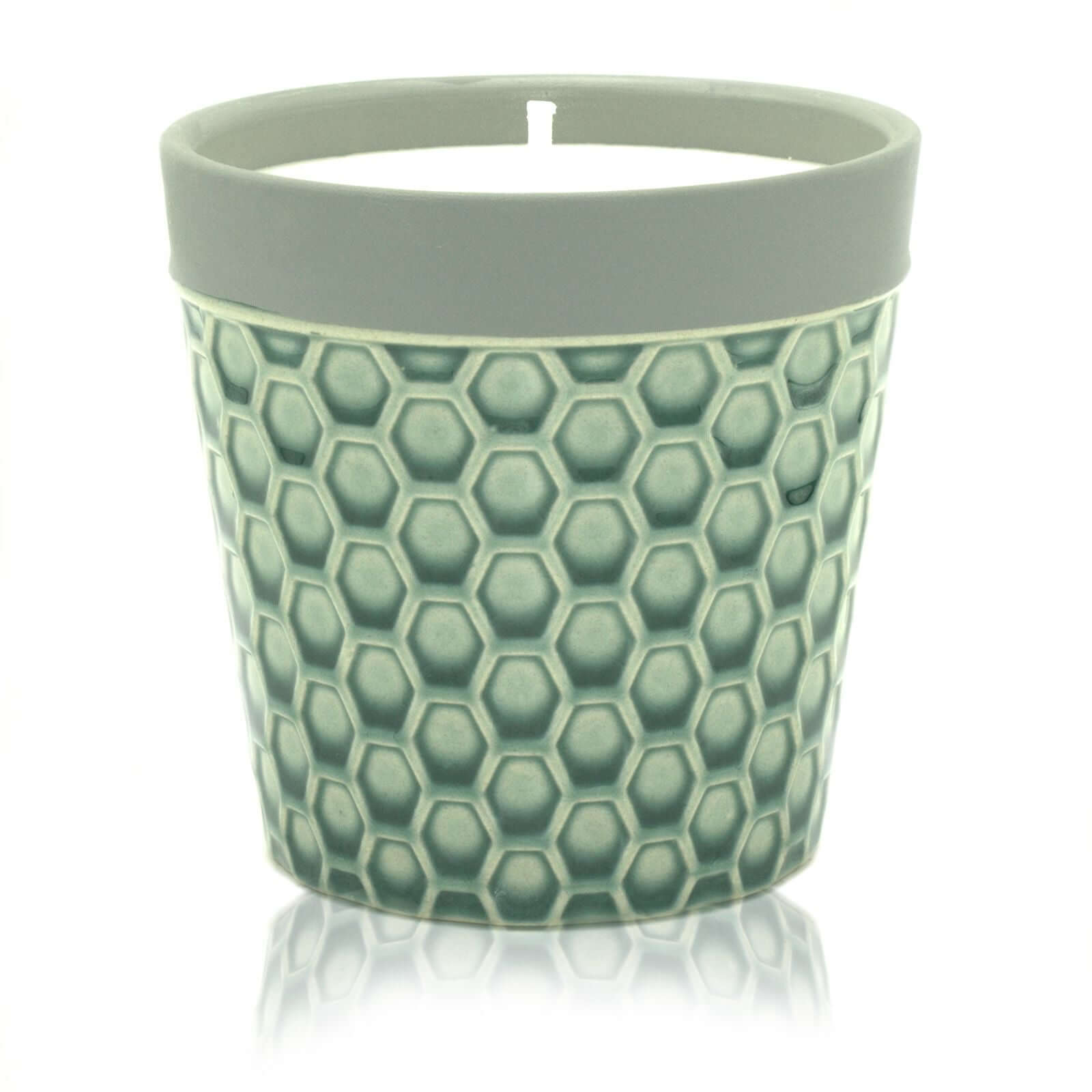 Home Candle displayed in a stylish hexagon patterned candle pot, perfect for enhancing home decor.