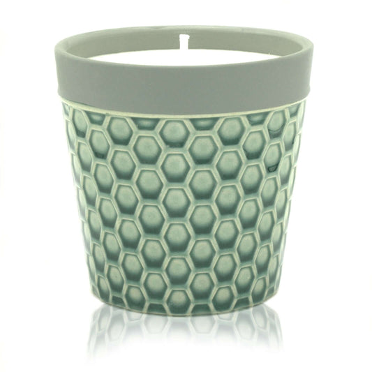Home Candle displayed in a stylish hexagon patterned candle pot, perfect for enhancing home decor.
