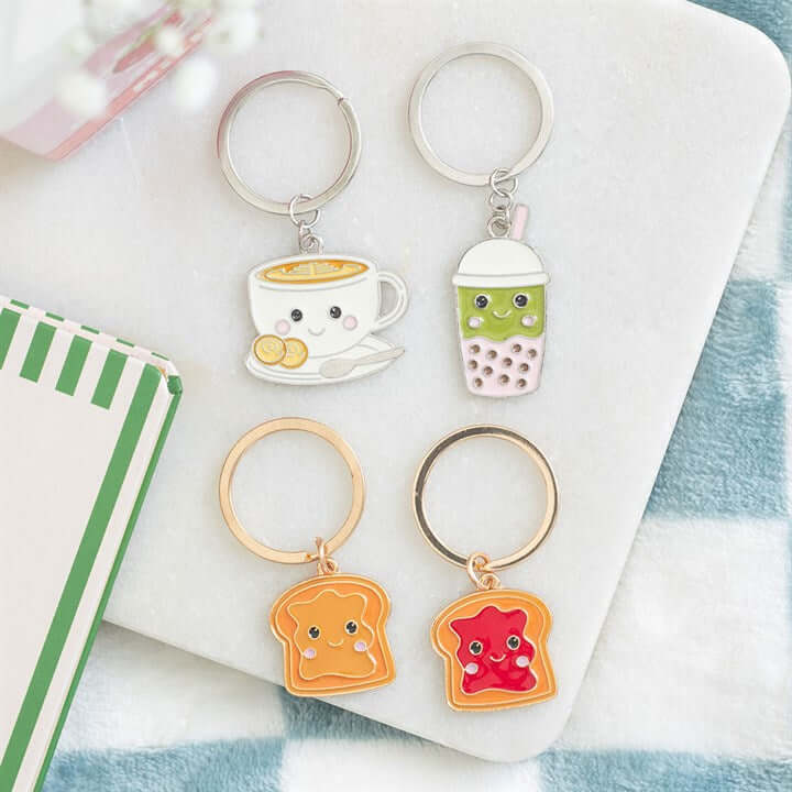 Kawaii Latte Keyring featuring cute smiling drink and toast keychains on a light surface.