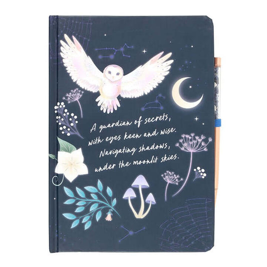Notebook with owl illustration and moonlit sky design on a dark blue background