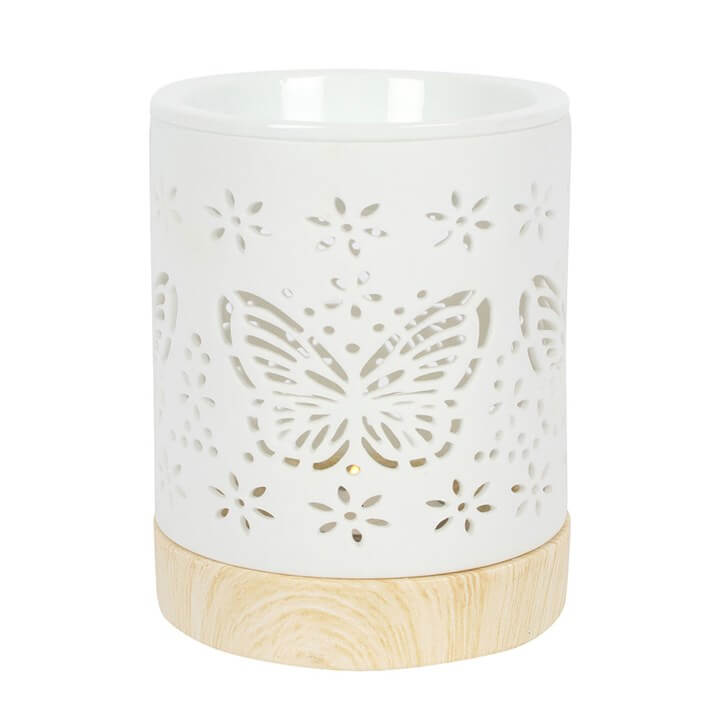 Matte Ceramic Butterfly Oil Burner with delicate cut-out details and a smooth matte finish, perfect for a calming glow.