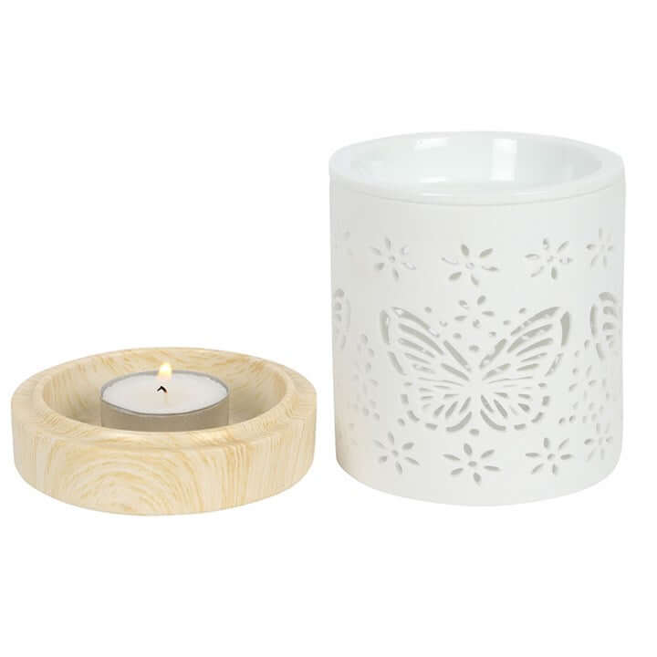 Matte Ceramic Butterfly Oil Burner with tealight candle, showcasing butterfly cut-out designs for soft illumination.