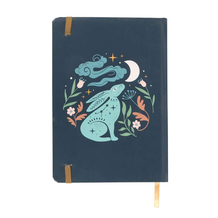 Notebook with a rabbit illustration on a dark blue background