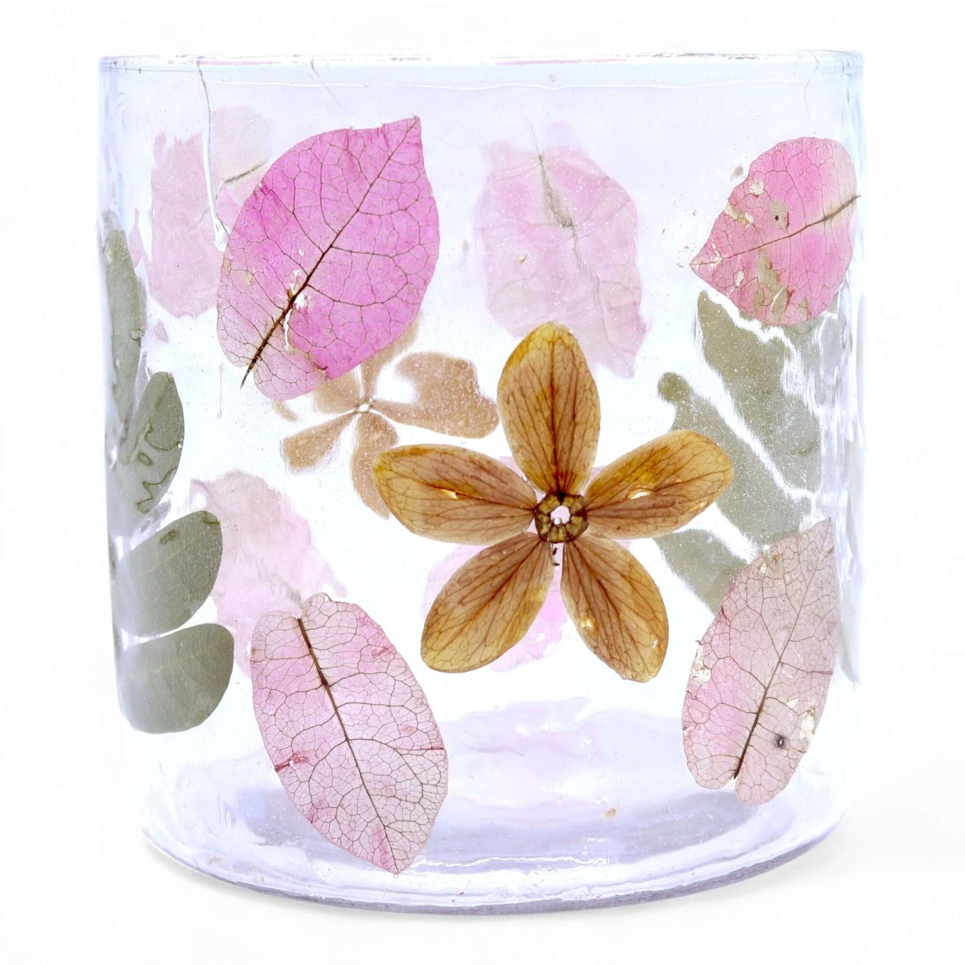 Natural Floral Glass Candle Holder showcasing pressed leaves and blossoms in pink and earthy tones.