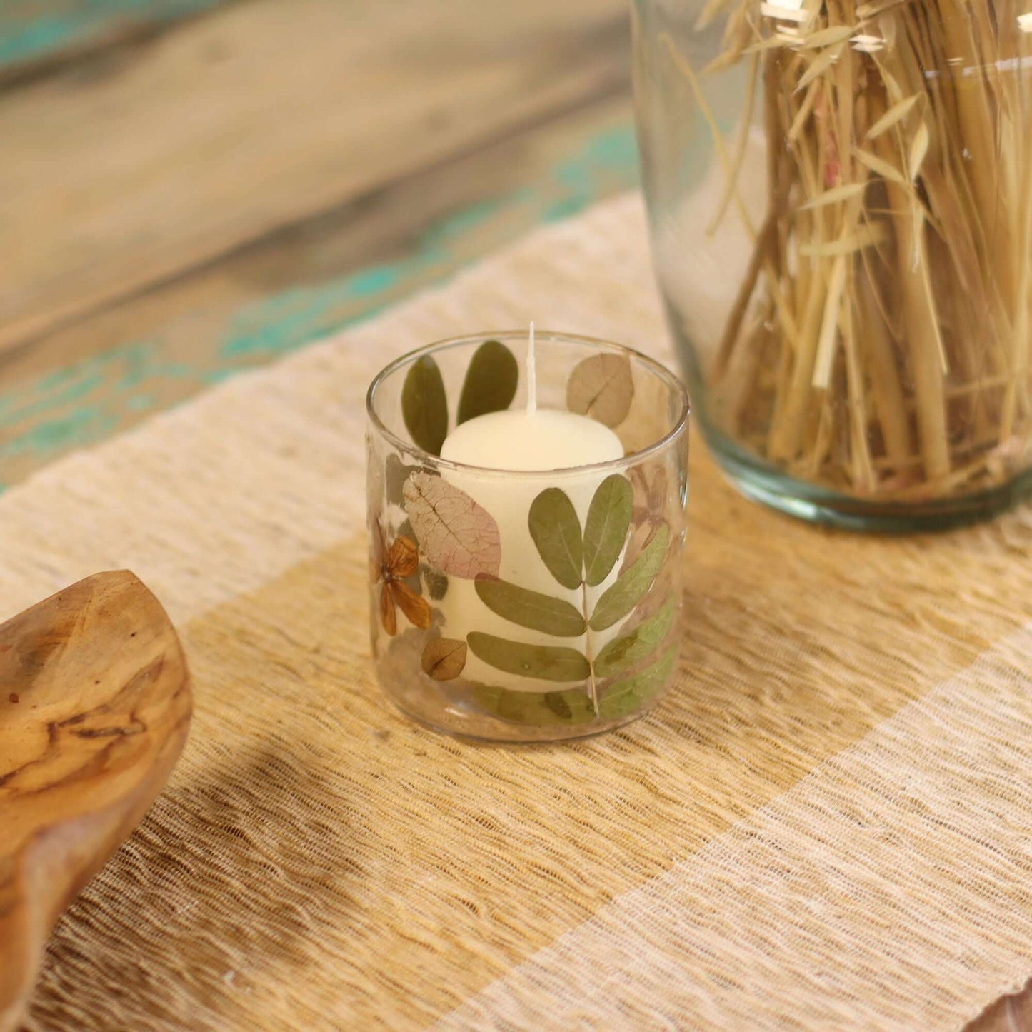 Natural Floral Candle Holder featuring pressed leaves and blossoms, perfect for tea lights in a home decor setting.