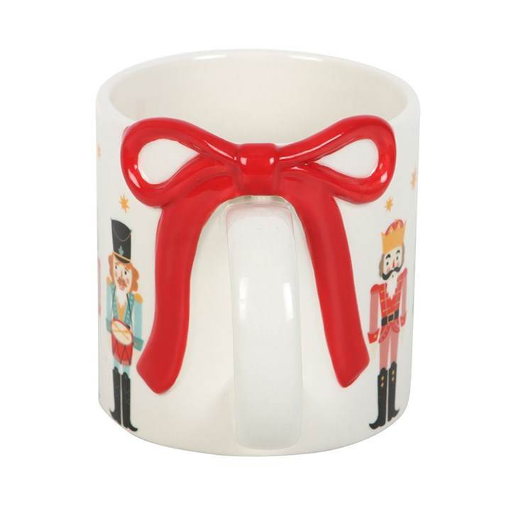 Nutcracker print mug with decorative bow handle, perfect for hot chocolate mug during the festive season.