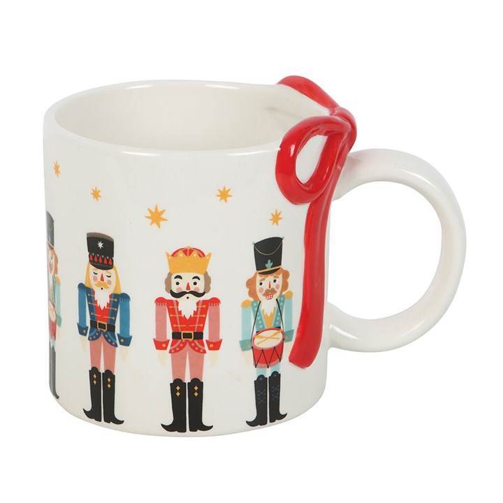 Nutcracker print mug with decorative bow, perfect for festive hot chocolate mug for holiday celebrations.