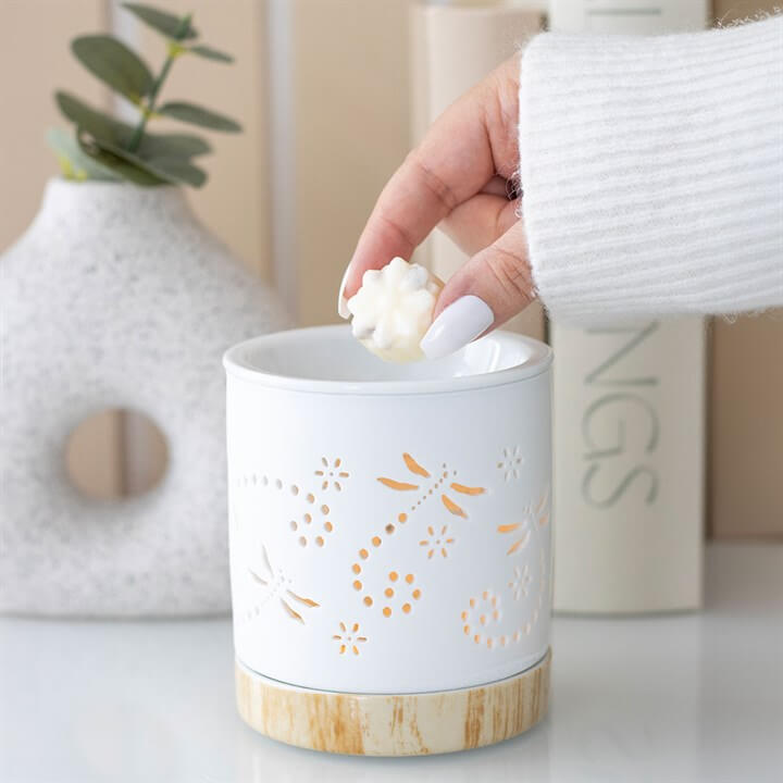 Matte Dragonfly Oil Burner with ceramic base and wood effect, adding wax melt for a soothing aroma.