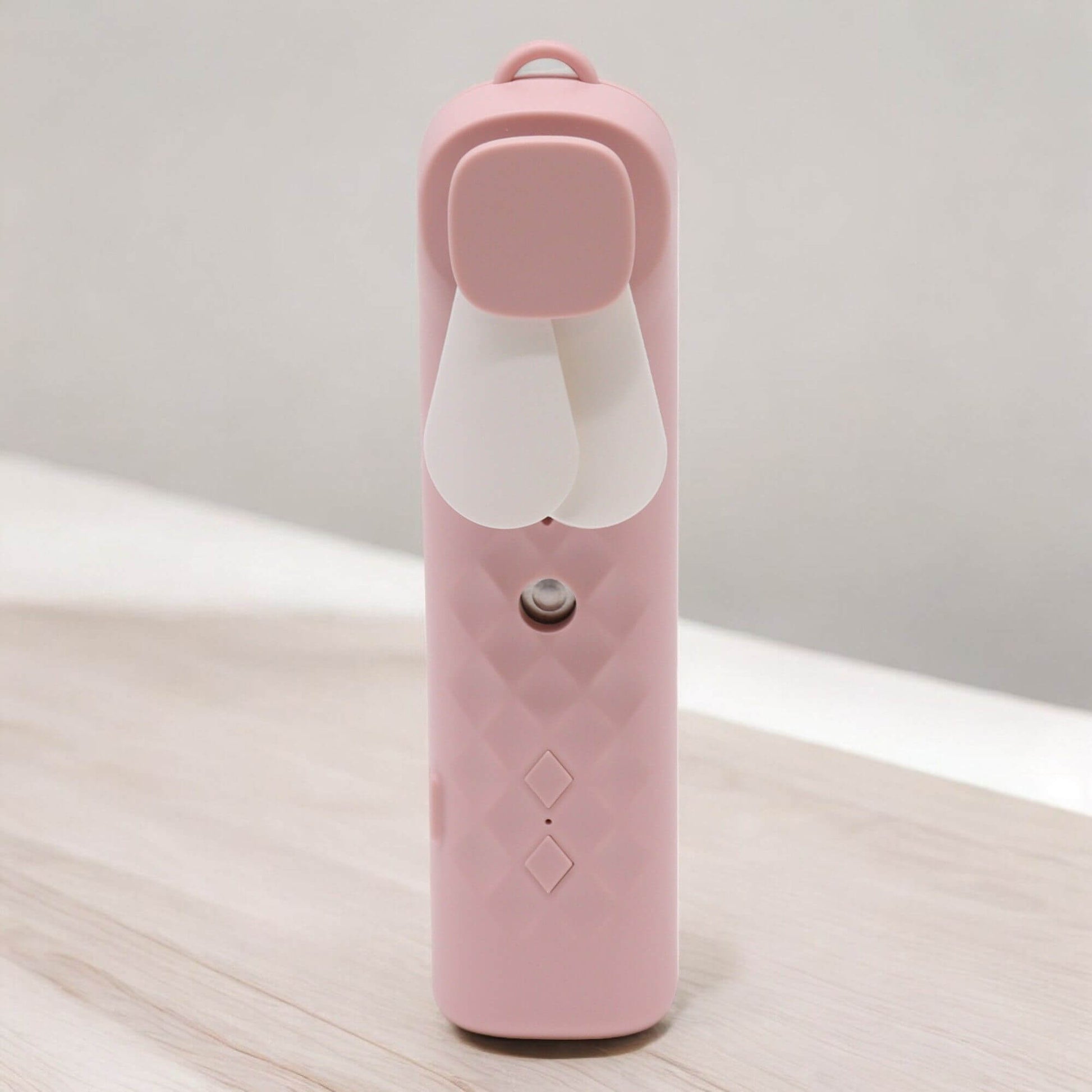 Pink Nano Mist Face Fan & Spray designed for on-the-go hydration and refreshment.
